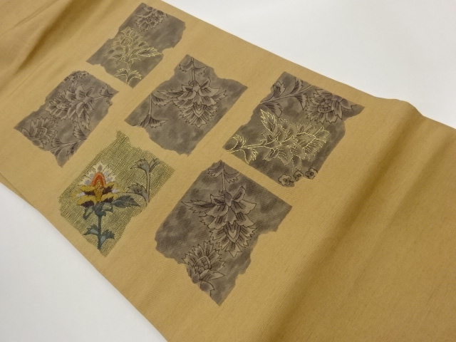 手織り紬金糸相良刺繍変わり色紙に花々模様名古屋帯